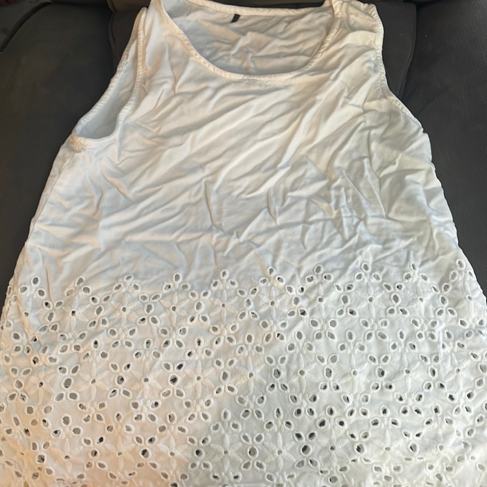 White tank top with floral design cutouts